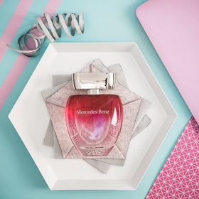 Lifestyle scene with Mercedes Benz Rose Eau De Toilette on a vanity