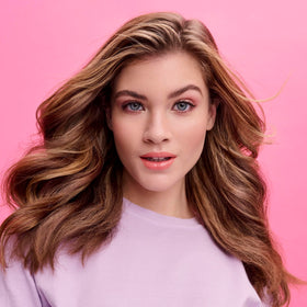 Lifestyle scene with Not Your Mother's Protect & Nourish Shampoo and Conditioner