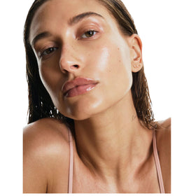 Lifestyle scene with Rhode Peptide Lip on a vanity