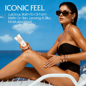 Lifestyle scene with VACATION Orange Gelée sunscreen on a beach