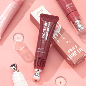 Lifestyle shot of a model applying URQT Brightening Lip Serum