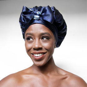 Lifestyle shot of a woman wearing Nochka Fashion silk bonnet