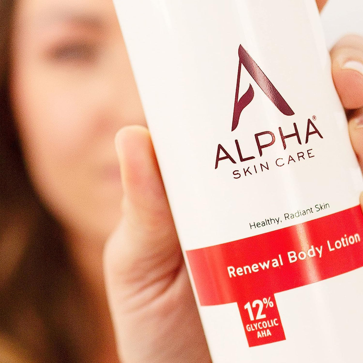 Lifestyle shot of Alpha Revitalizing Body Lotion 12% Glycolic AHA in bathroom