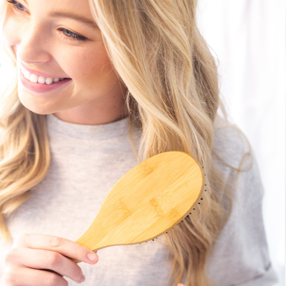 Lifestyle shot of Beauty by Earth Hair Brush in use