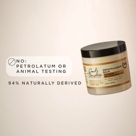 Lifestyle shot of Carol's Daughter Goddess Strength Hair Balm in use