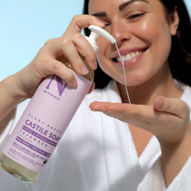 Lifestyle shot of Dr. Natural Castile Liquid Soap in bathroom setting