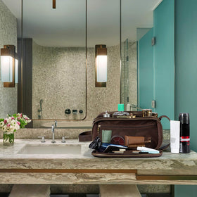 Lifestyle shot of Elviros Toiletry Bag in use during travel