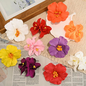 Lifestyle shot of flower hair clips worn at the beach