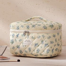 Lifestyle shot of HBselect makeup bag set in a travel setting