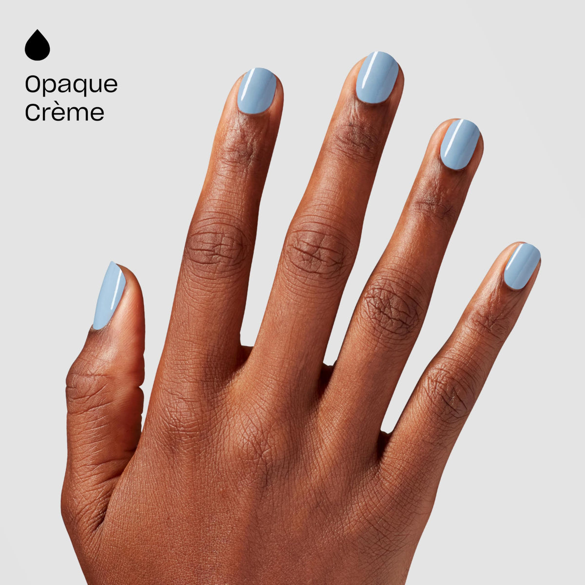Lifestyle shot of nails painted with OPI Baggy Jean Baby