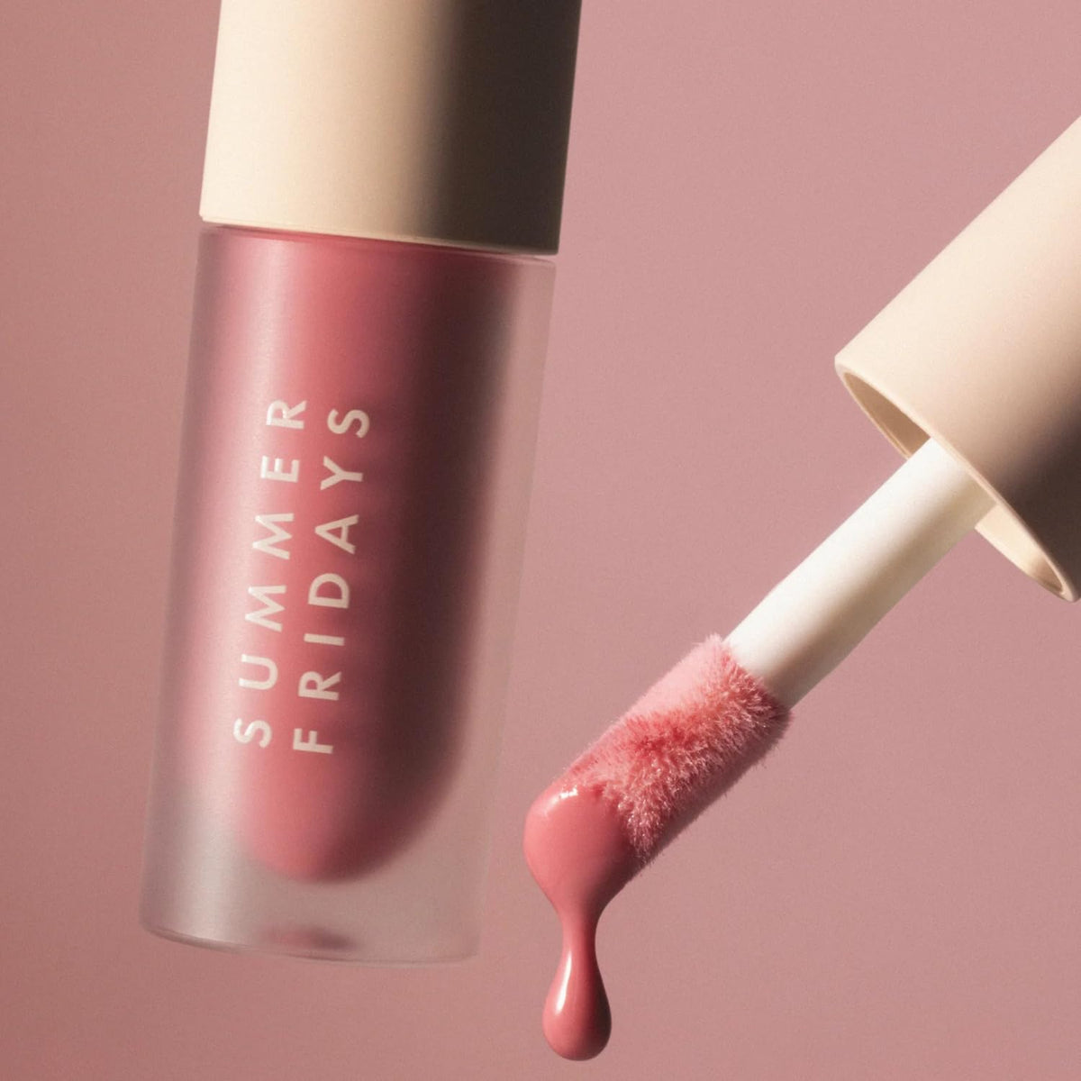 Lifestyle shot of Summer Fridays Dream Lip Oil in use