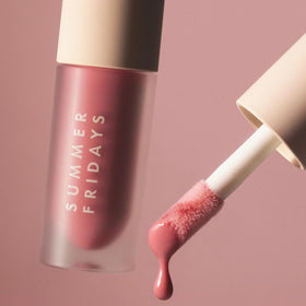 Lifestyle shot of Summer Fridays Dream Lip Oil in use