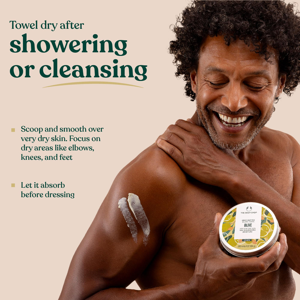 Lifestyle shot of The Body Shop Olive Body Butter in use