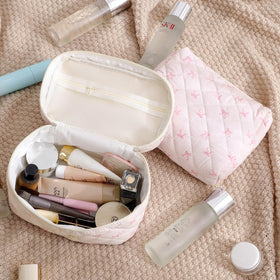 Lifestyle shot of uekeboag Large Travel Quilted Makeup Bag on a vanity