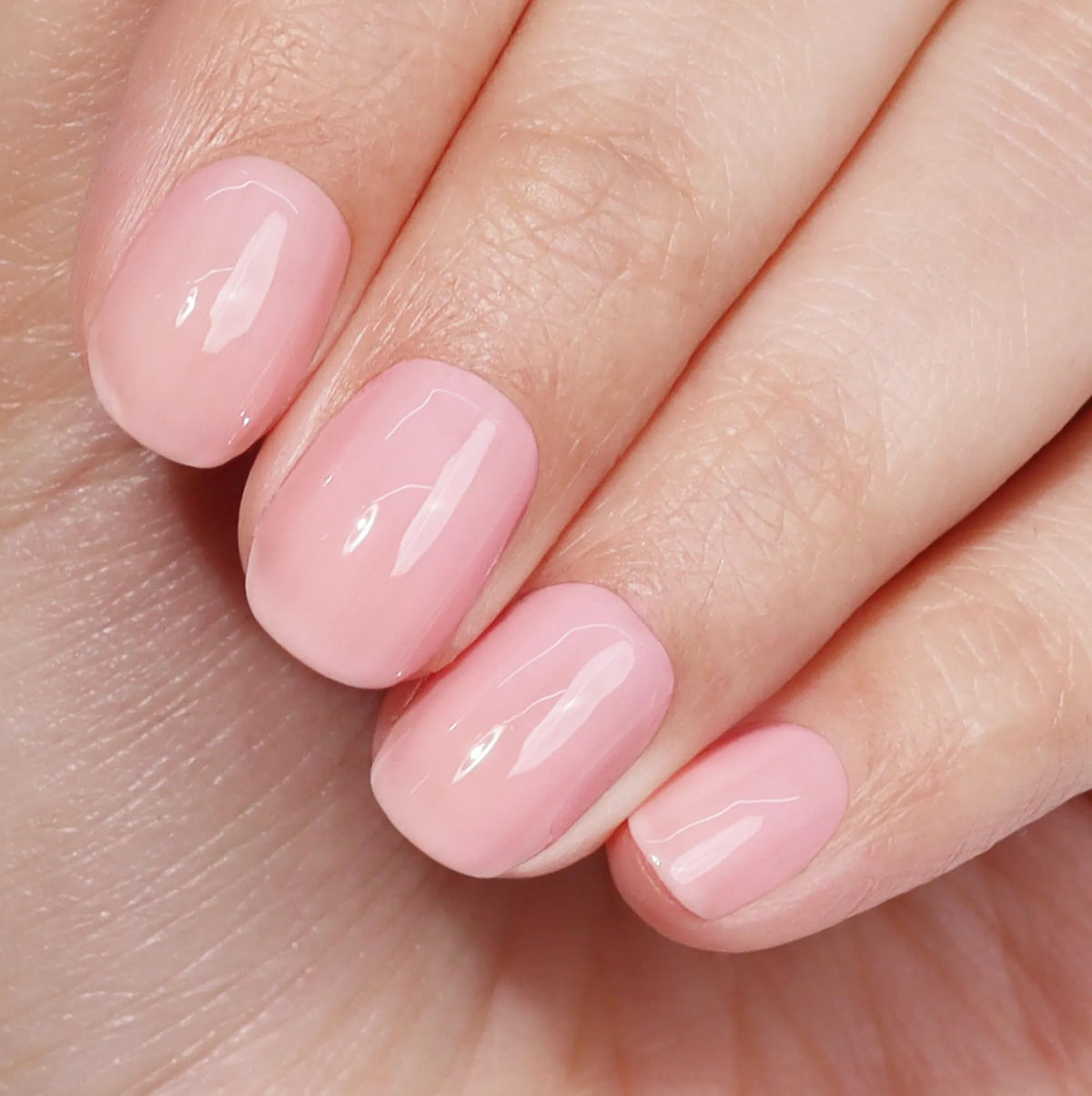 LONDONTOWN kur Perfecting Nail Veil Cherry Blossom Pink in use during manicure