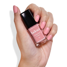 LONDONTOWN lakur Nail Polish Desert Flower bottle with floral background