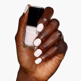 LONDONTOWN lakur Nail Polish Macaroon at Noon on a nail display