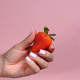 LONDONTOWN lakur Nail Polish Strawberry Milk on a nail art display