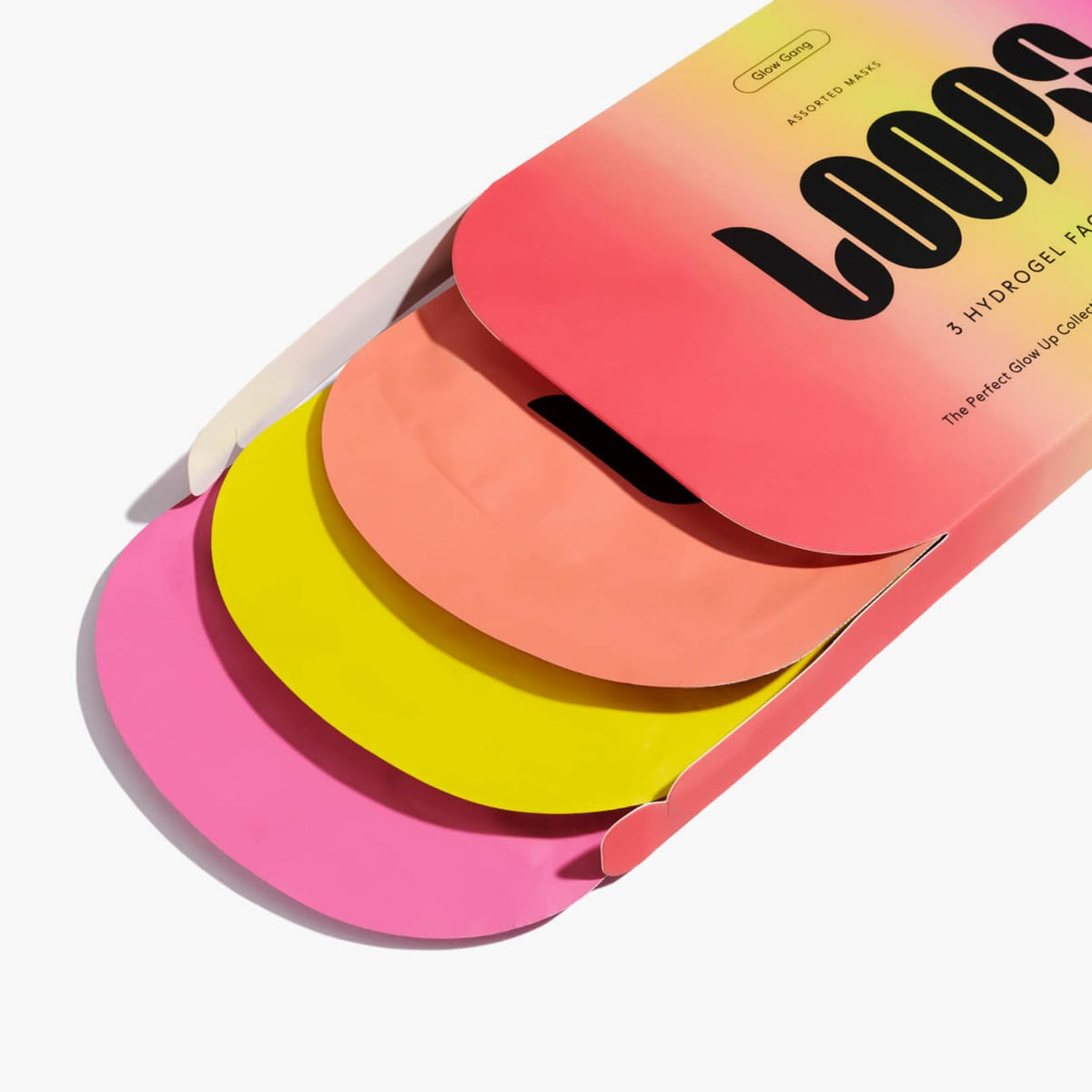 LOOPS face mask with serum being tapped into skin