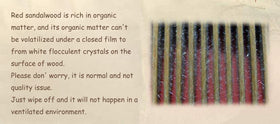 Louise Maelys Red Sandalwood Wide Tooth Comb in hand
