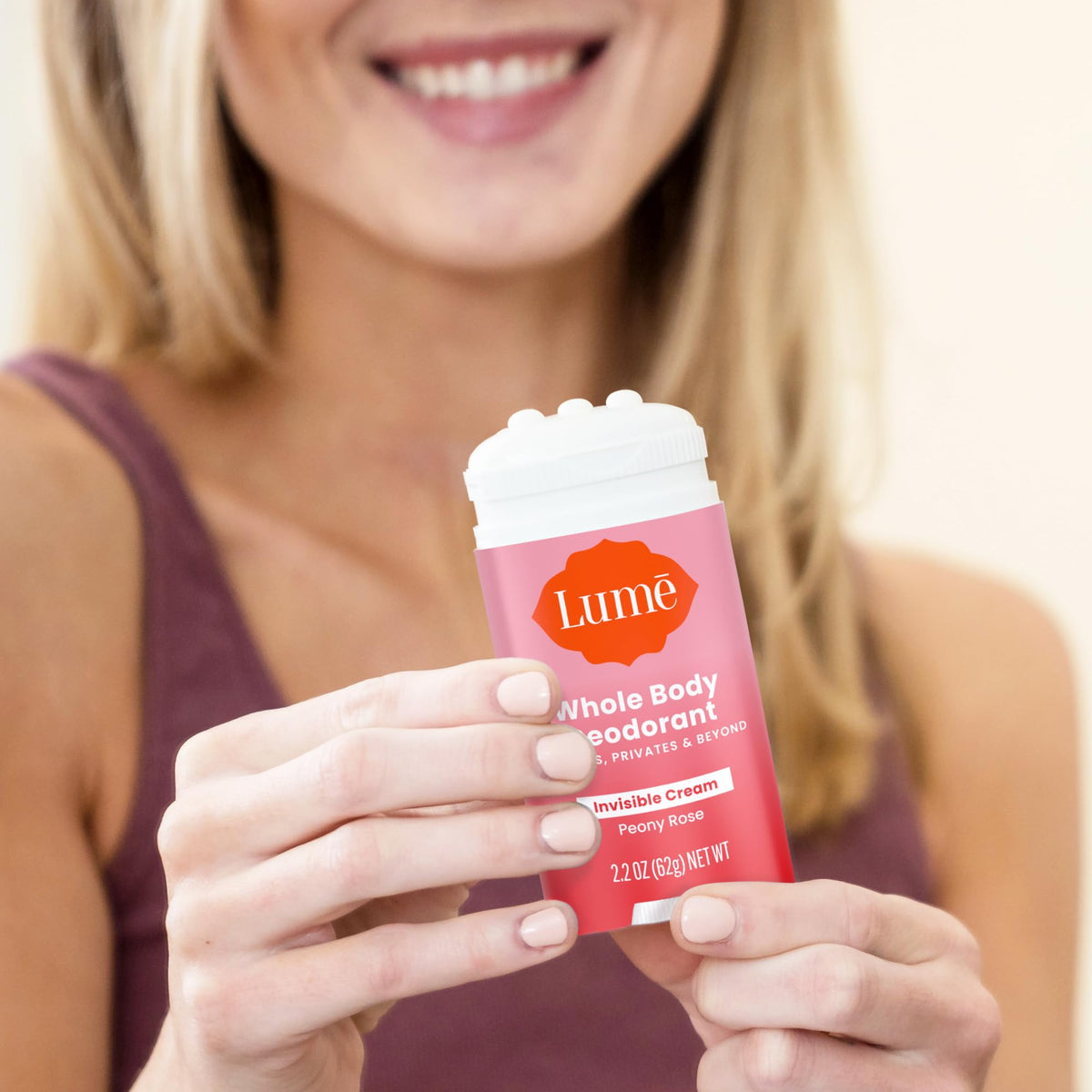 Lume Deodorant Cream Stick with floral background
