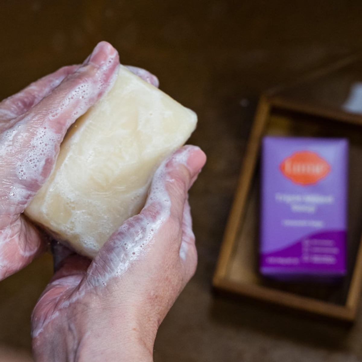 Lume Triple Milled Bar Soap Lavender Sage lathering on skin