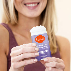 Lume Whole Body Deodorant Cream Stick 2.2 oz in bathroom setting