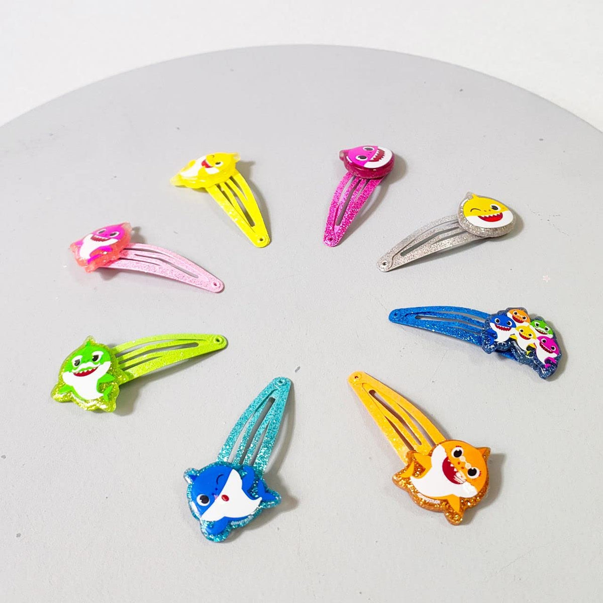 LUV HER Baby Shark Kids Hair Clips in a child's hand