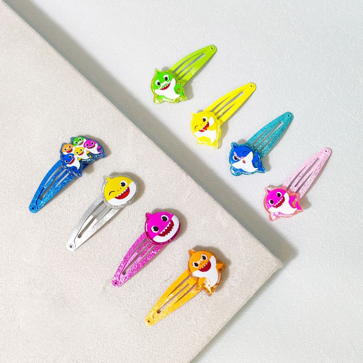 LUV HER Baby Shark Kids Hair Clips on a vanity table