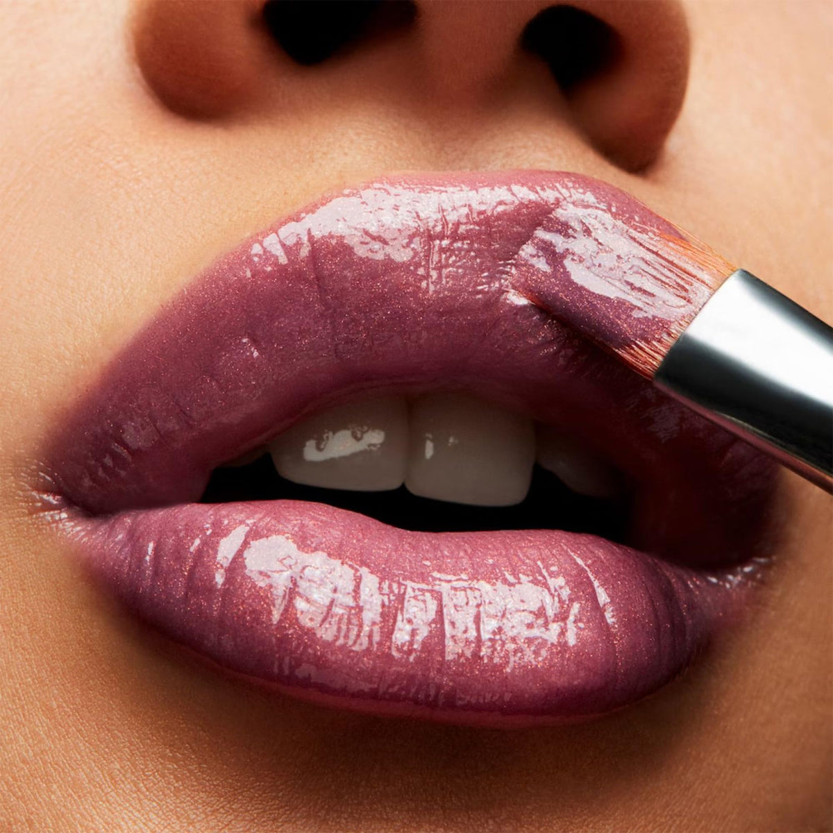 MAC Lipglass LOVECHILD swatch on skin