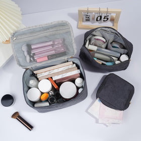 MAGEFY makeup bag set arranged on a travel suitcase