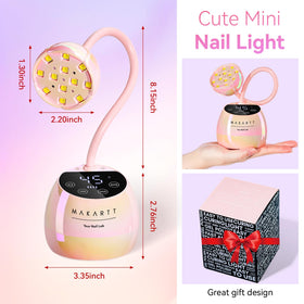 Makartt UV Nail Lamp on a vanity with nail art supplies