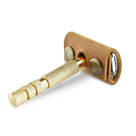 MAKYN leather razor cover side view showcasing button closure