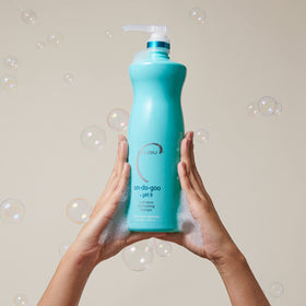 Malibu C Un-Do-Goo Clarifying Shampoo in a bathroom setting