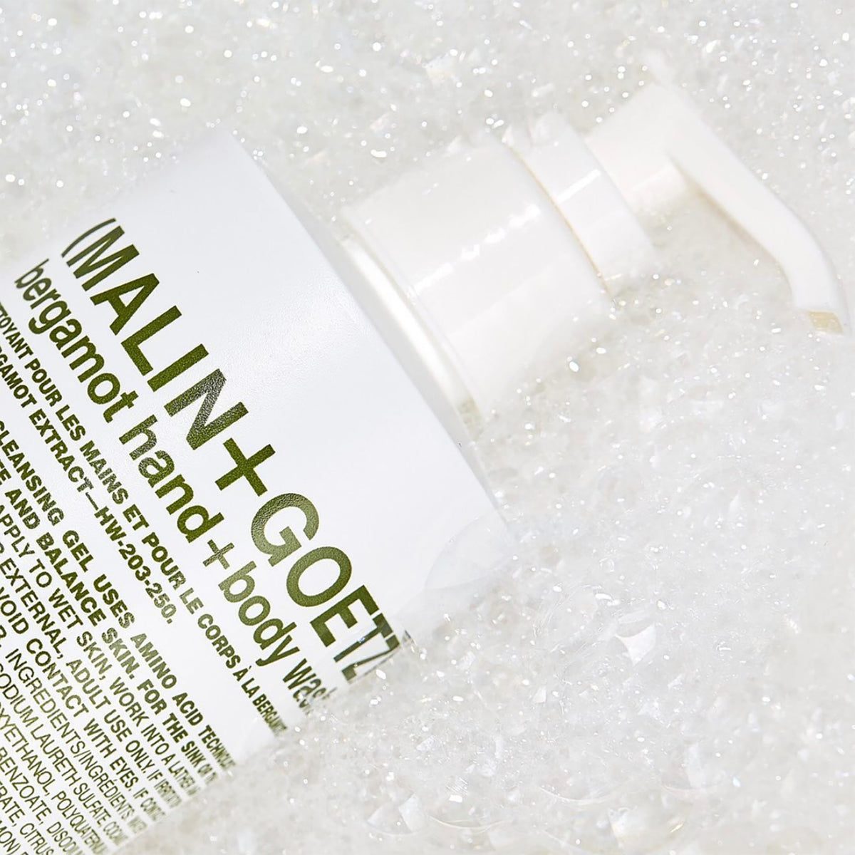 MALIN+GOETZ Bergamot Hand + Body Wash in a shower setting