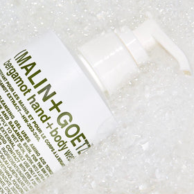 MALIN+GOETZ Bergamot Hand + Body Wash in a shower setting