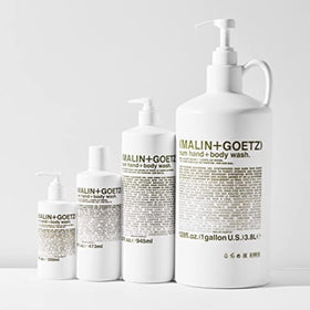MALIN+GOETZ Rum Hand + Body Wash in a minimalist bathroom
