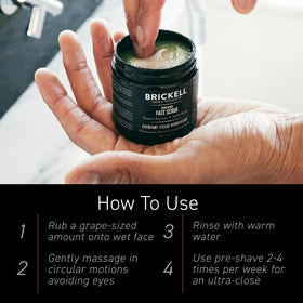Man using Brickell Men's Renewing Face Scrub in bathroom