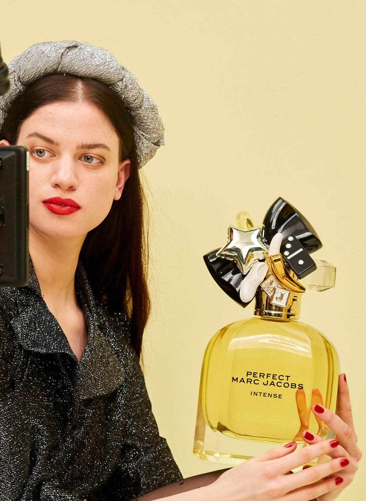 Marc Jacobs Perfect Intense Eau de Parfum bottle with floral background
