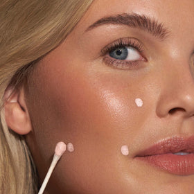 Mario Badescu Drying Lotion application with cotton swab