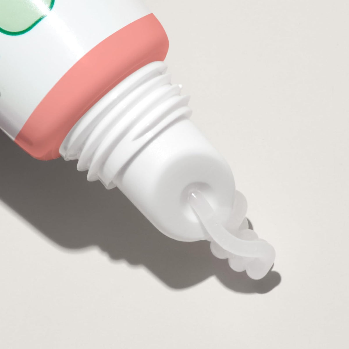 Mario Badescu Rose Lip Balm showing texture on fingertip