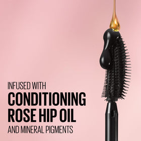 MAYBELLINE Lash Sensational Mascara in hand with a natural makeup look