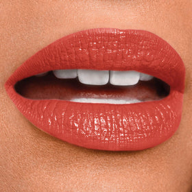 MAYBELLINE Super Stay 24 Liquid Lipstick Continuous Coral on model's lips