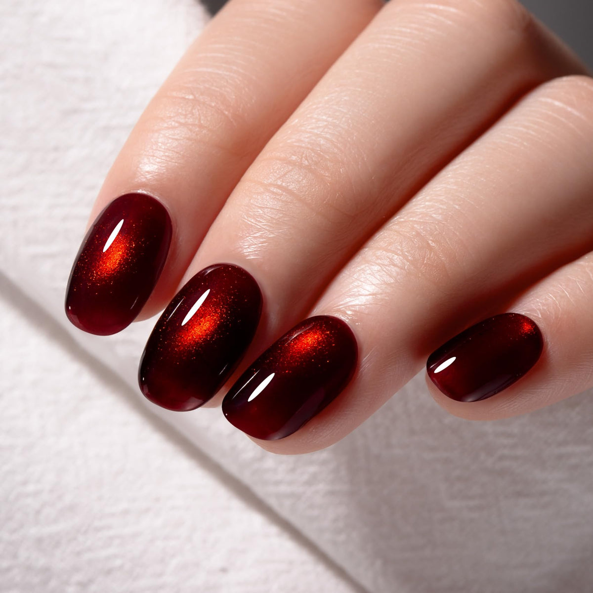 MAYCHAO Dark Cherry Red Cat Eye Gel Nail Polish 15ML on nails with cat-eye effect