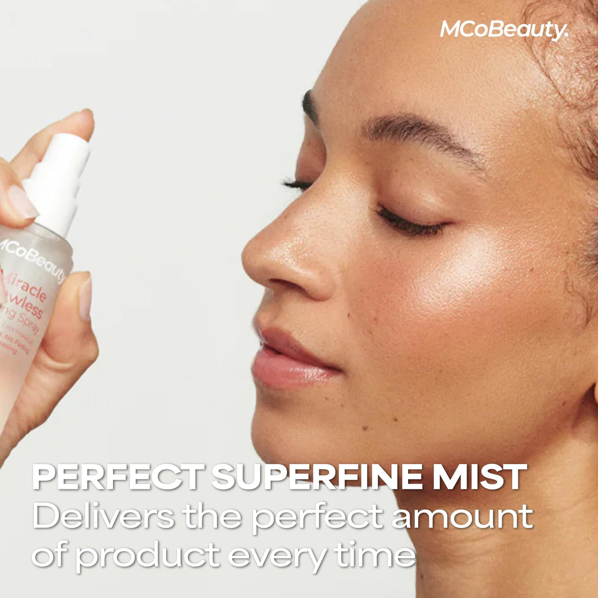 MCoBeauty Miracle Flawless Setting Spray misting on skin