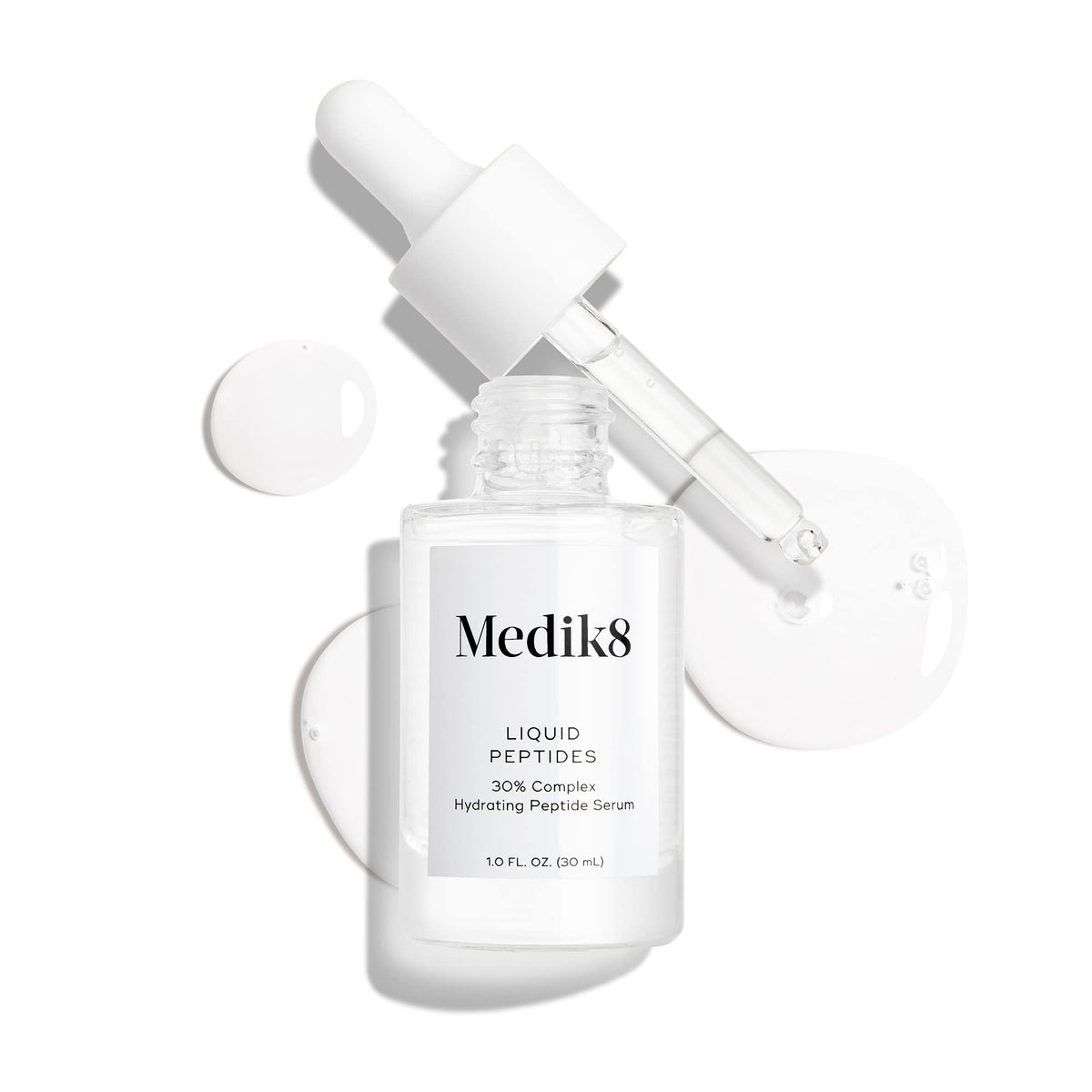 Medik8 Liquid Peptides serum bottle with a soft towel