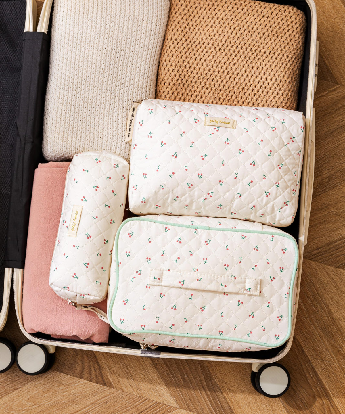 Medium size HBselect makeup bag opened with cosmetics inside