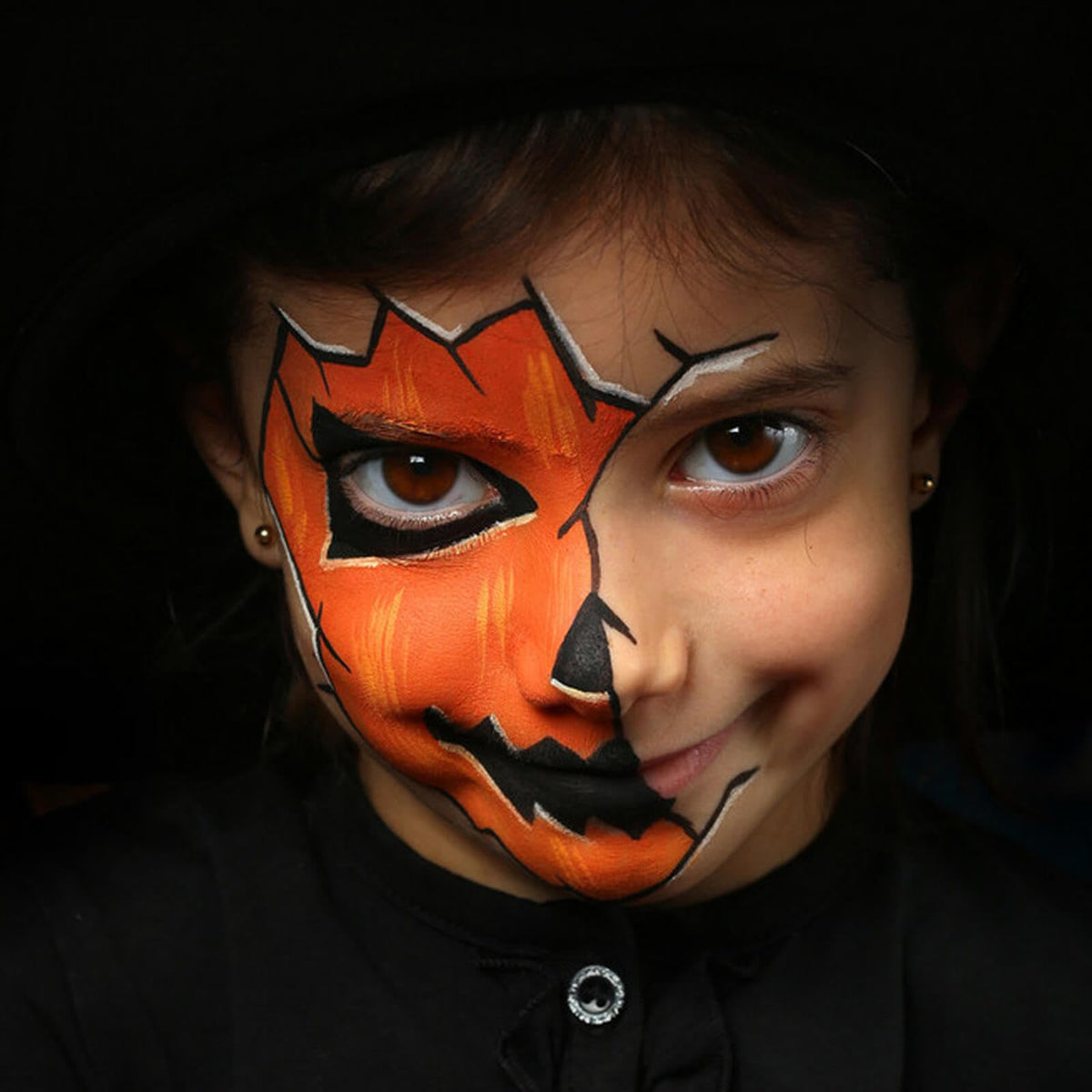 MEICOLY Orange Face Body Paint Stick alongside makeup tools