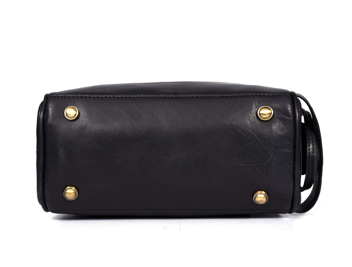 Metal studs on the bottom of AARON Leather Toiletry Pouch