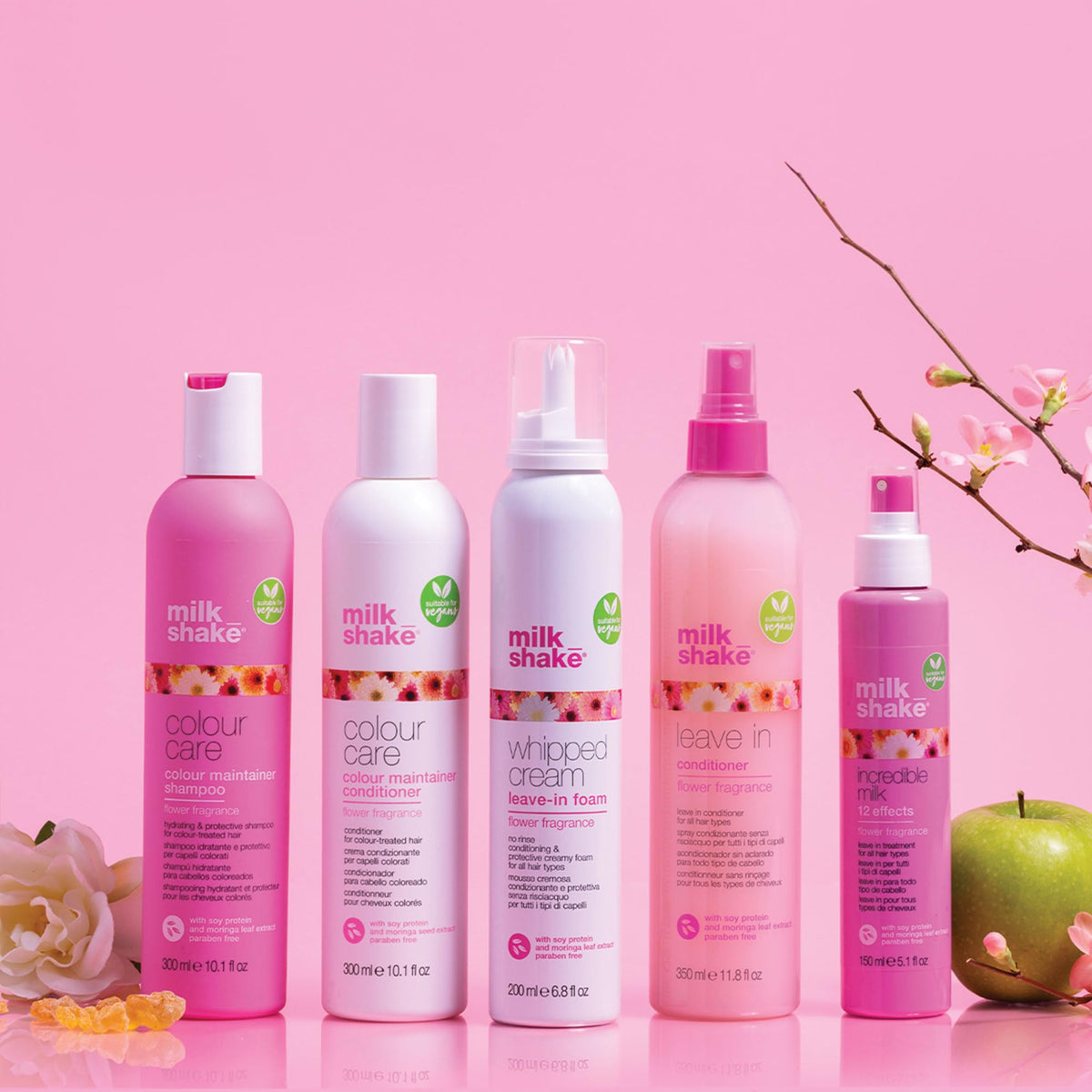 milk_shake Leave-In Conditioner Detangling Spray with hair in the background